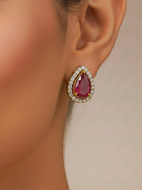 Close-up of a woman wearing an ornate Indo-western Red Collar Layered Diamond jewellery set and earrings with American Diamond and Colored Stones. Festive Diwali outfit styled with an American diamond artificial necklace. Party wear outfit completed with a lightweight American diamond necklace.