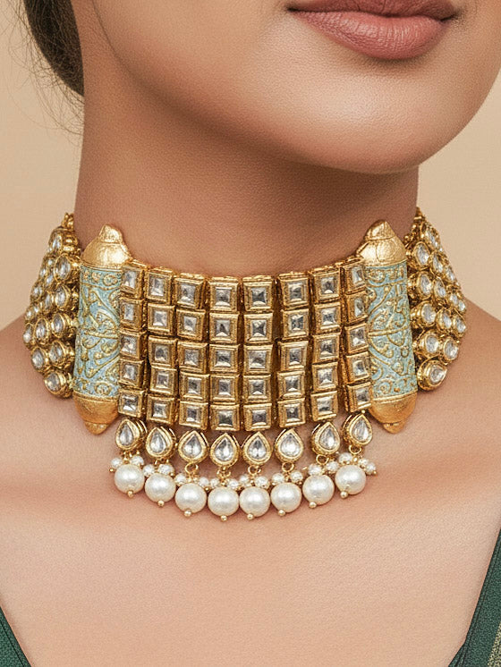 Close-up of a woman wearing an ornate traditional Meenakari gold Choker jewellery set and earrings with Kundan, Meenakari and Pearls. Reception party styling featuring a premium Meenakari imitation set. Close-up of detailed enamel craftsmanship in Meenakari jewelry.