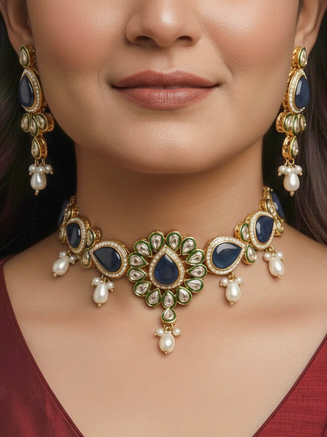 Close-up of a women wearing an ornate traditional Navy Blue Choker jewellery set and earrings and maangtikka with Kundan, Monalisa Stone, American Diamonds, Beads and Reverse American Diamonds and tumble stones. A graceful woman wearing a trending Colored Stone necklace for a 2026 wedding celebration. Elegant wedding jewelry look featuring a premium artificial Colored Stone necklace.