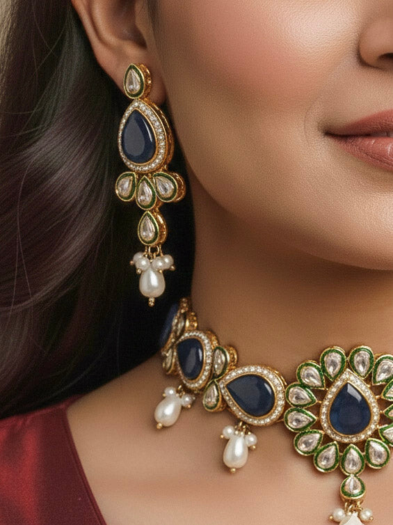 Close-up of a women wearing an ornate traditional Navy Blue Choker jewellery set and earrings and maangtikka with Kundan, Monalisa Stone, American Diamonds, Beads and Reverse American Diamonds and tumble stones. A graceful woman wearing a trending Colored Stone necklace for a 2026 wedding celebration. Elegant wedding jewelry look featuring a premium artificial Colored Stone necklace.