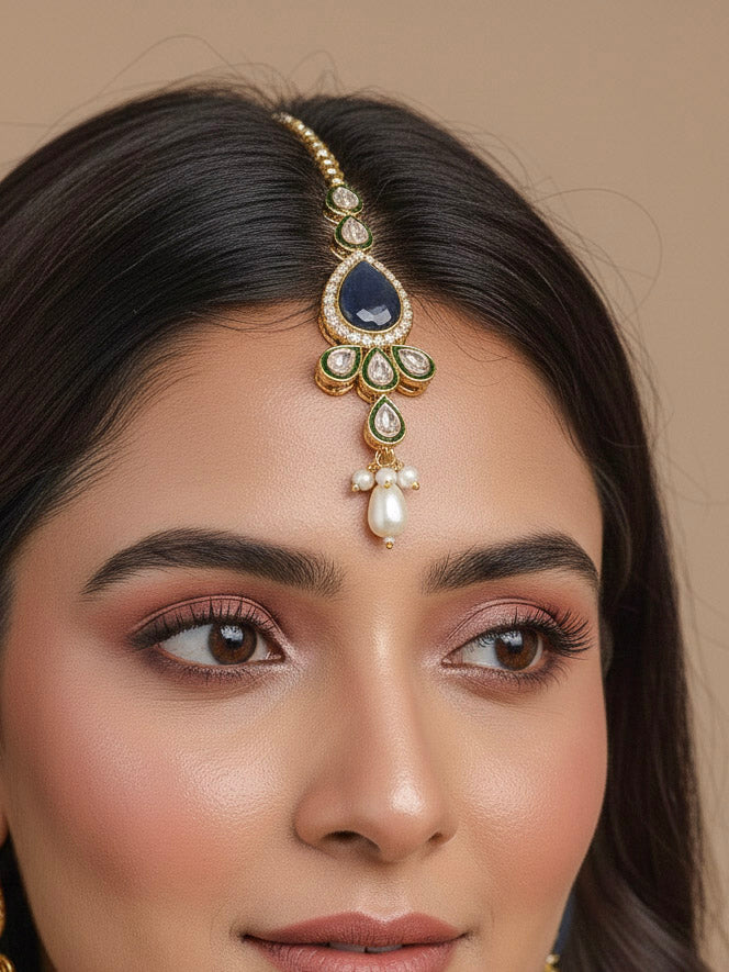 Close-up of a women wearing an ornate traditional Navy Blue Choker jewellery set and earrings and maangtikka with Kundan, Monalisa Stone, American Diamonds, Beads and Reverse American Diamonds and tumble stones. A graceful woman wearing a trending Colored Stone necklace for a 2026 wedding celebration. Elegant wedding jewelry look featuring a premium artificial Colored Stone necklace.