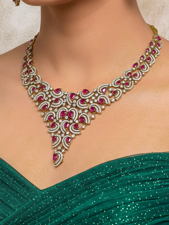 Close-up of a woman wearing an ornate Indo-Western Red Diamond gold Collar jewellery set and earrings with American Diamond and Red Colored Stones. Close-up of a cocktail party look featuring a premium American diamond necklace. Mehendi function outfit styled with a lightweight American Diamond necklace.