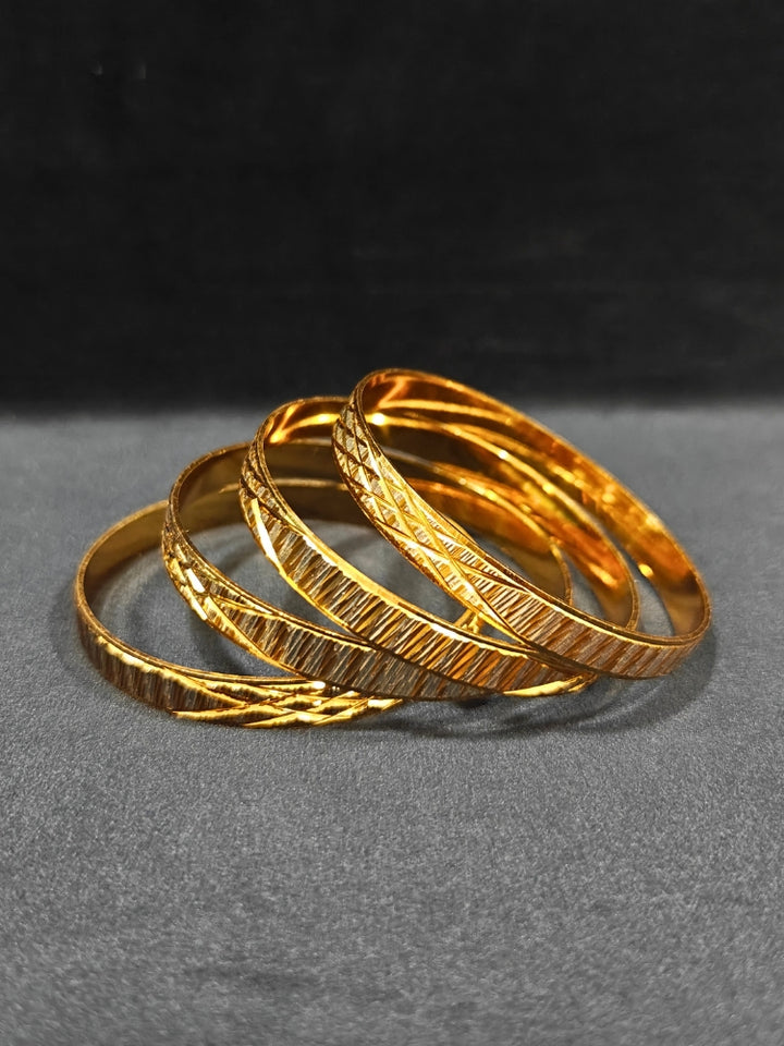Close-up of an ornate traditional (Gold Polish) Bangles Set. It’s comfortable and lightweight enough for everyday wear, and it also looks absolutely beautiful and elegant. The design is stylish, the finish is impressive, and it feels really pleasant to wear all day.