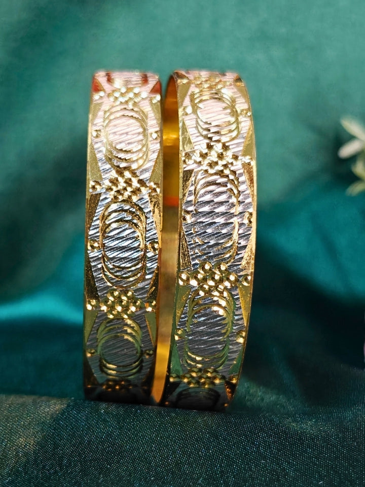 Close-up of an ornate traditional (Gold Polish) Gold & Silver  Bangles Set. It’s comfortable and lightweight enough for everyday wear, and it also looks absolutely beautiful and elegant. The design is stylish, the finish is impressive, and it feels really pleasant to wear all day.