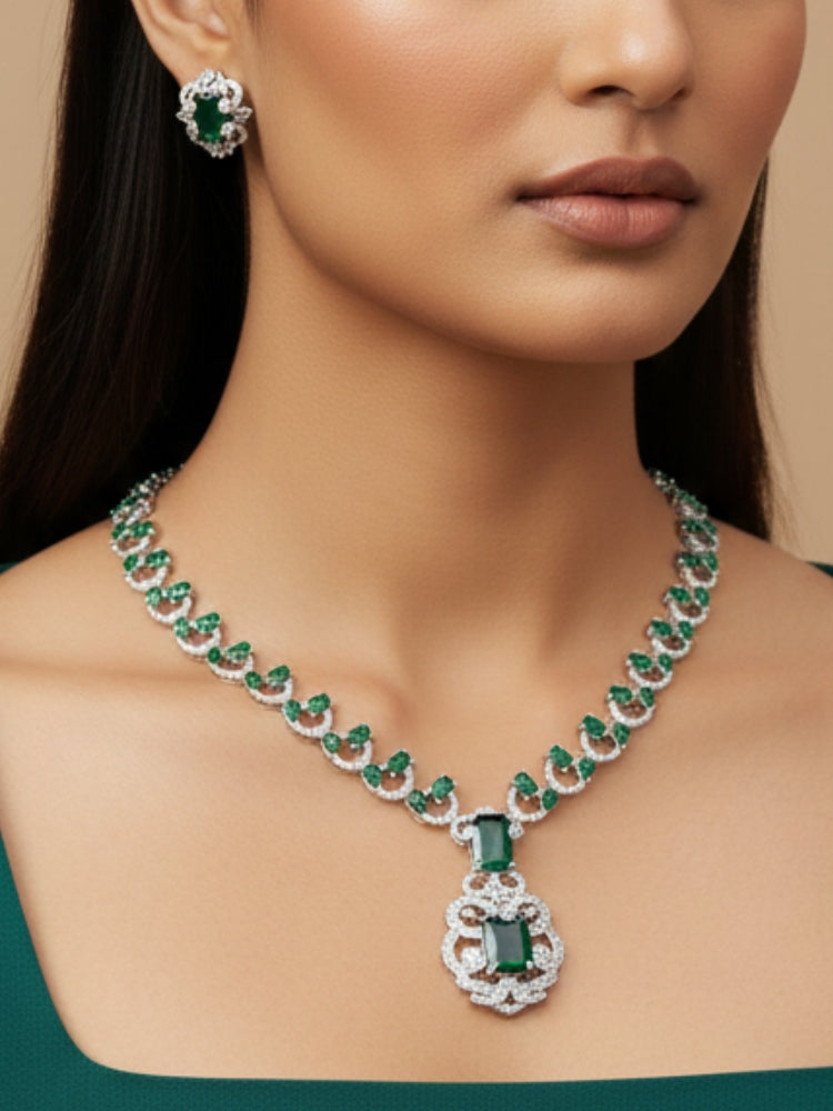 This luxurious emerald and diamond necklace set features a stunning arrangement of vivid green emeralds framed by sparkling diamonds.Crafted for timeless elegance, this fine jewelry set is ideal for weddings, evening wear, and special occasions. Its classic design and rich green tones add sophistication and glamour to any outfit.