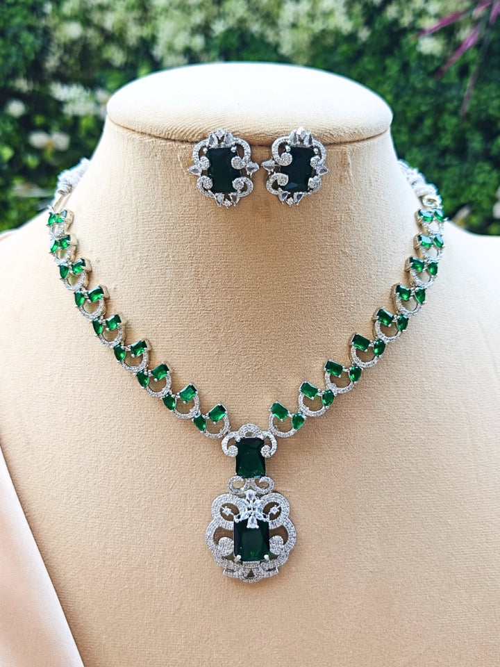 This luxurious emerald and diamond necklace set features a stunning arrangement of vivid green emeralds framed by sparkling diamonds.Crafted for timeless elegance, this fine jewelry set is ideal for weddings, evening wear, and special occasions. Its classic design and rich green tones add sophistication and glamour to any outfit.