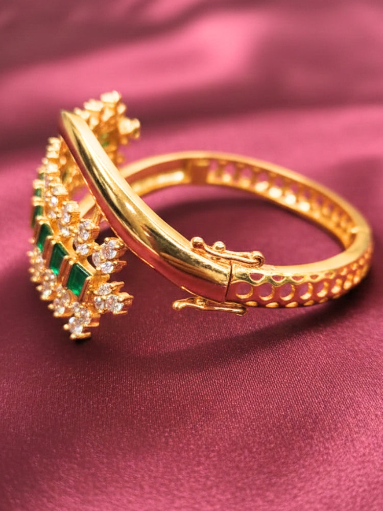 Close-up of an ornate Indo-western Green (Bright gold) Diamond Bracelet with American Diamond and Colored Stones. A sparkling American diamond artificial bracelet for a party. Close-up of an anti-tarnish artificial American Diamond bracelet styled for wedding guests.
