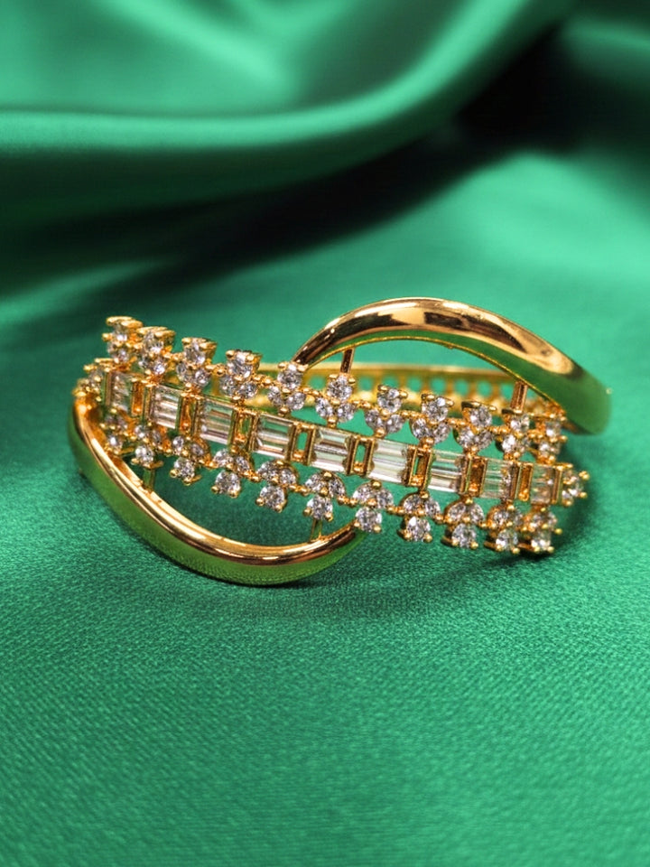 Close-up of an ornate Indo-western White (Bright gold) Diamond Bracelet with American Diamond and Colored Stones. A sparkling American diamond artificial bracelet for a party. Close-up of an anti-tarnish artificial American Diamond bracelet styled for wedding guests.