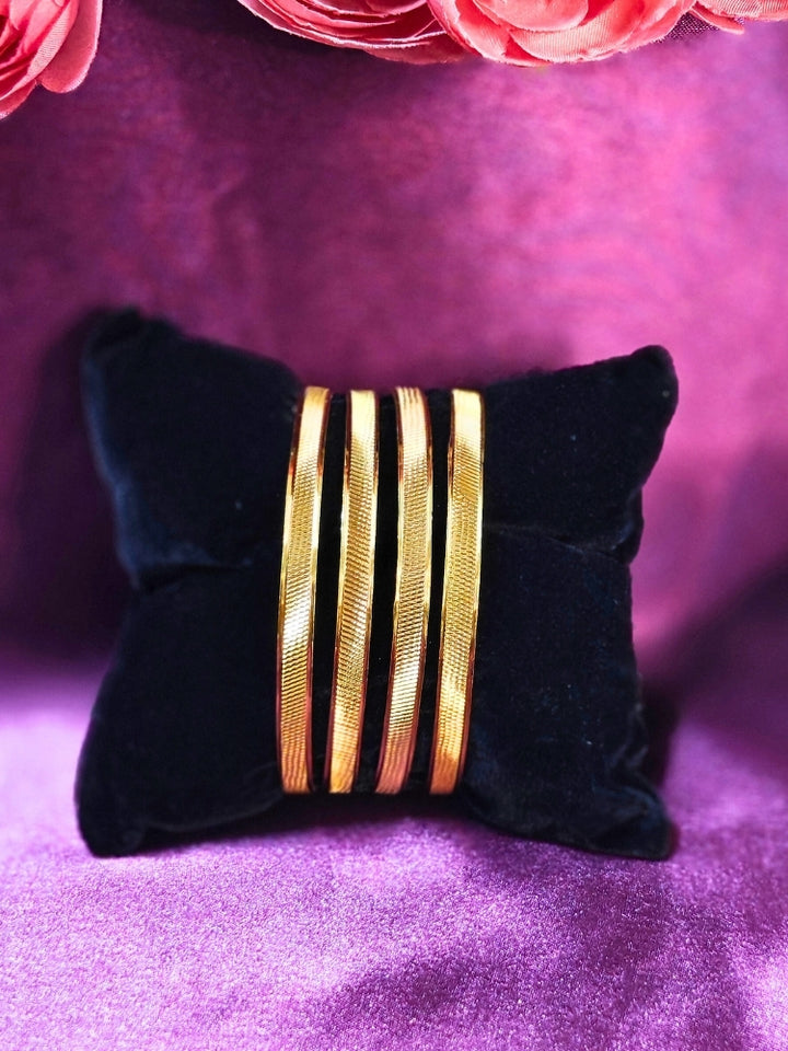 Close-up of an ornate traditional (Gold Polish) Bangles Set. It’s comfortable and lightweight enough for everyday wear, and it also looks absolutely beautiful and elegant. The design is stylish, the finish is impressive, and it feels really pleasant to wear all day.