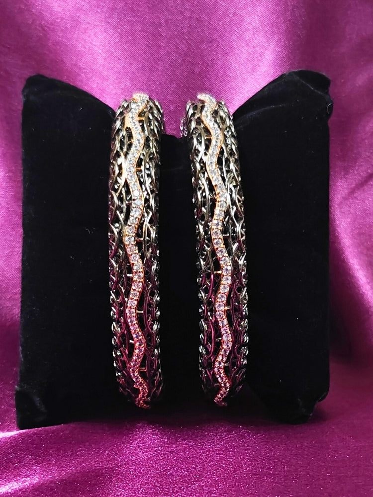 Close-up of an ornate Indo-western (Black Polish) Bangles with American Diamond. Wedding guest styling elegant artificial American Diamond bangles in India. Close-up of sparkling artificial American Diamond bangles for party wear. Luxury artificial American Diamond bangles styled for a wedding function.
