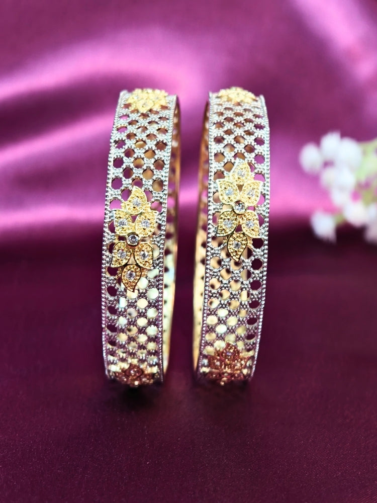 Close-up of an ornate Indo-Western (Silver Polish) Bangles Set with American Diamond. A anti-tarnish artificial American Diamond bangles for long functions. Wedding guest styling elegant artificial American Diamond bangles in India.