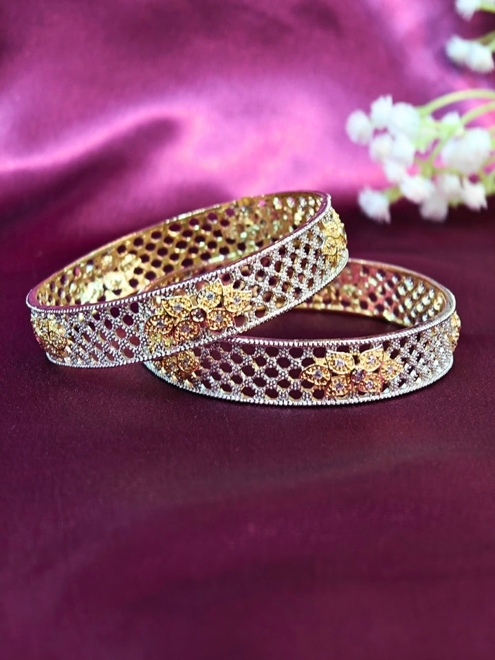 Close-up of an ornate Indo-Western (Silver Polish) Bangles Set with American Diamond. A anti-tarnish artificial American Diamond bangles for long functions. Wedding guest styling elegant artificial American Diamond bangles in India.