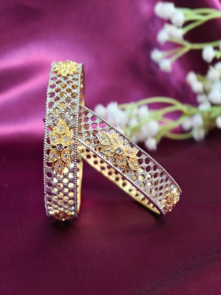 Close-up of an ornate Indo-Western (Silver Polish) Bangles Set with American Diamond. A anti-tarnish artificial American Diamond bangles for long functions. Wedding guest styling elegant artificial American Diamond bangles in India.