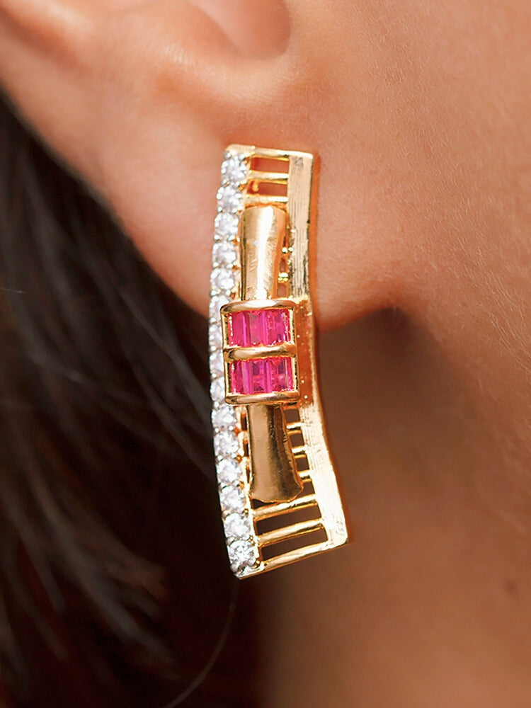 A woman wears the Noctelle Pink Necklace Set—gold with red and white diamond stones in a geometric design. The American Diamonds jewelry beautifully complements her warm skin tone and natural makeup.