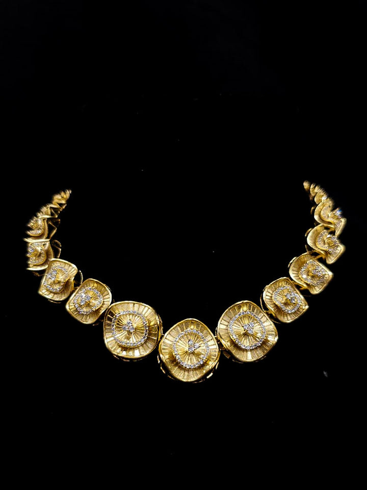 An elegant artificial diamond necklace and matching earrings. This premium artificial diamond jewelry set is perfect for special occasions, from Indian weddings to engagement parties, offering sophisticated glamour without the high price tag.