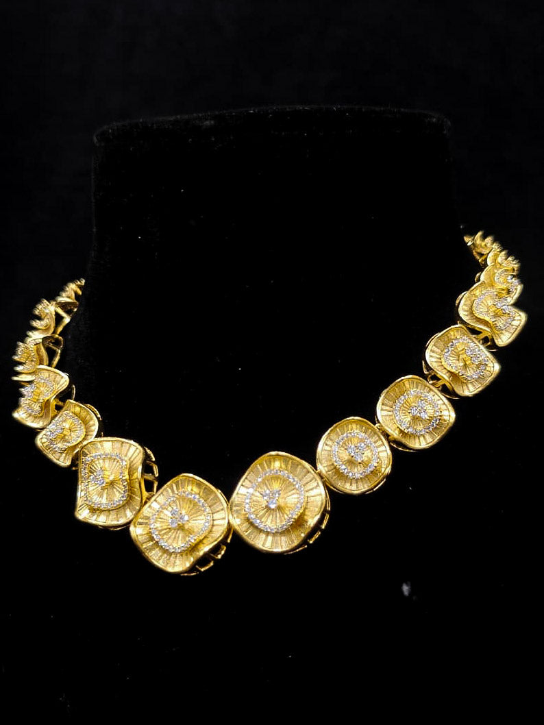 An elegant artificial diamond necklace and matching earrings. This premium artificial diamond jewelry set is perfect for special occasions, from Indian weddings to engagement parties, offering sophisticated glamour without the high price tag.