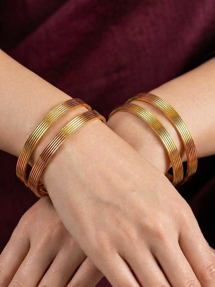 Close-up of an a women wearing ornate traditional (Gold Polish) Bangles Set. It’s comfortable and lightweight enough for everyday wear, and it also looks absolutely beautiful and elegant. The design is stylish, the finish is impressive, and it feels really pleasant to wear all day.