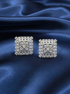 Close-up of an ornate Western (Silver Polish) White Diamond Studs Earrings with American Diamond. Indo-western dress styled with lightweight artificial American Diamond studs earrings. Wear in office and everyday.