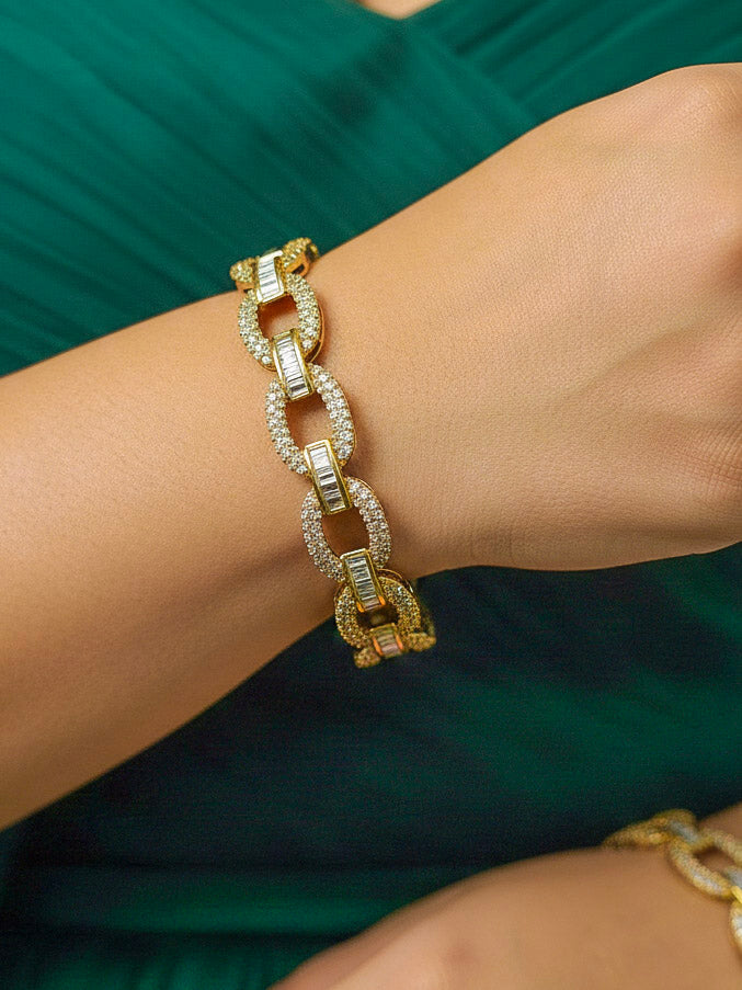 Close-up of a woman wearing an ornate Indo-western White Diamond (Mehendi Polish) Bangles with American Diamond. Close-up shot of a high-quality American diamond artificial Bangles worn for festive celebrations. Wedding guest styling elegant artificial American Diamond bangles in India.