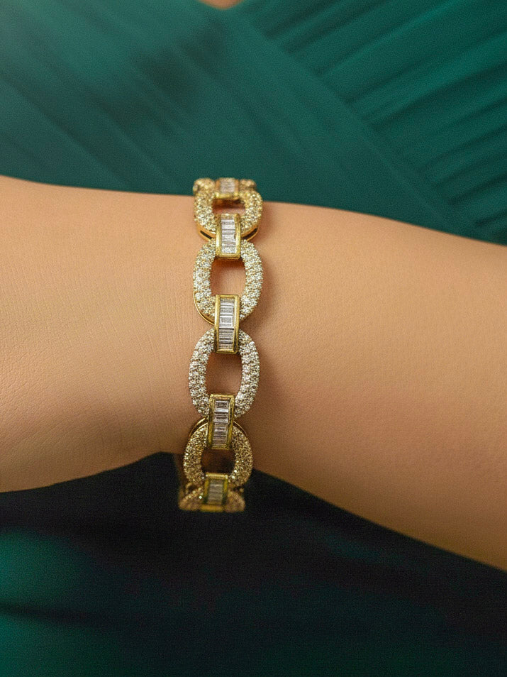 Close-up of a woman wearing an ornate Indo-western White Diamond (Mehendi Polish) Bangles with American Diamond. Close-up shot of a high-quality American diamond artificial Bangles worn for festive celebrations. Wedding guest styling elegant artificial American Diamond bangles in India.