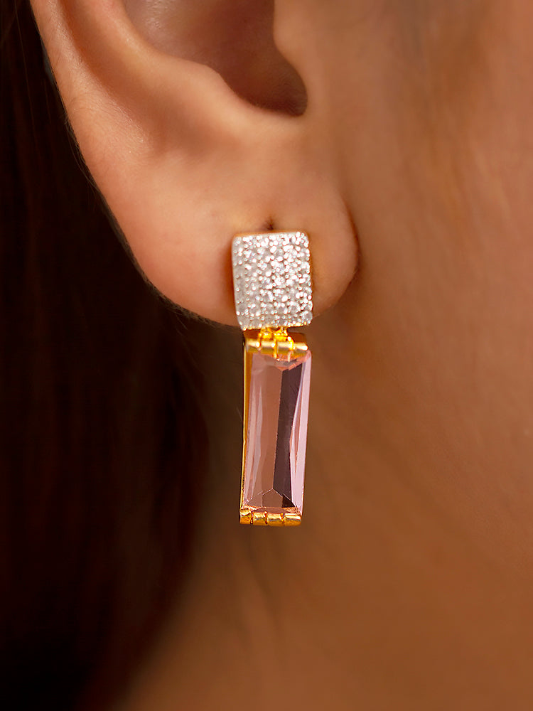 Close-up of a woman wearing an ornate Western Mint Pink (gold Polish) Diamond Pendant set and earrings with American Diamond and Mint Pink Colored Stones. Reception-ready look featuring a statement American diamond Pendant  set. Close-up shot of a high-quality American diamond artificial Pendant worn for festive celebrations.