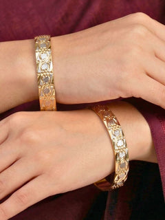 Close-up of an a women wearing ornate traditional (Gold Polish) Gold & Silver Bangles Set. It’s comfortable and lightweight enough for everyday wear, and it also looks absolutely beautiful and elegant. The design is stylish, the finish is impressive, and it feels really pleasant to wear all day.