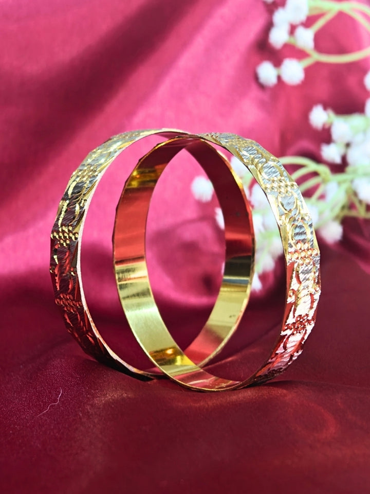 Close-up of an ornate traditional (Gold Polish) Gold & Silver Bangles Set. It’s comfortable and lightweight enough for everyday wear, and it also looks absolutely beautiful and elegant. The design is stylish, the finish is impressive, and it feels really pleasant to wear all day.