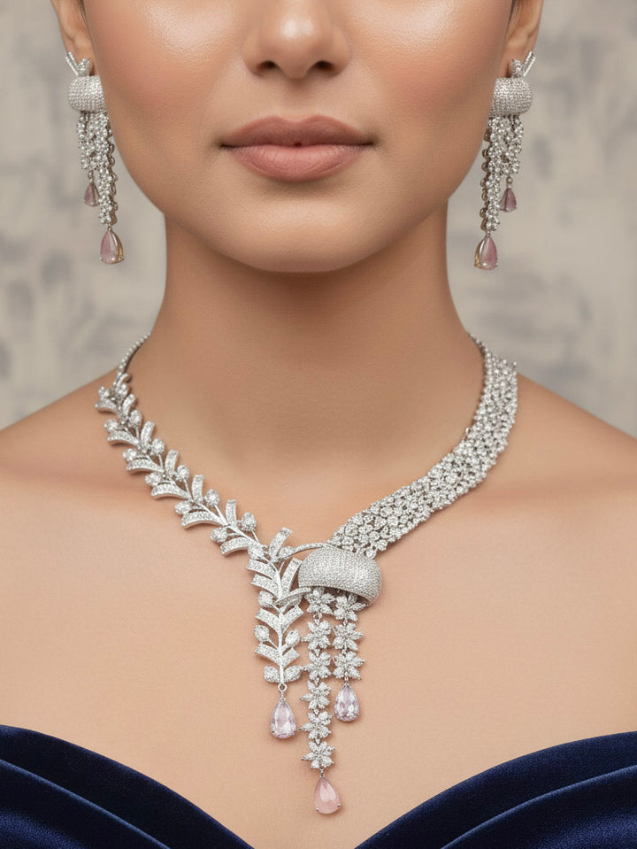 "A bride-to-be wearing an exquisite artificial diamond and mint pink colored stone necklace and matching earrings, designed for the perfect engagement look. This stunning artificial diamond jewelry set offers luxury and sophistication while being an affordable alternative to natural diamonds."