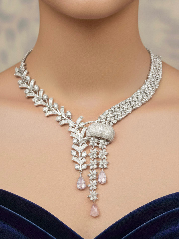 "Close-up of a woman wearing a sparkling artificial diamond and mint pink colored stone necklace and diamond earrings set, designed to offer a radiant, elegant look for any formal occasion or Indian wedding. This affordable diamond jewelry provides a flawless, luxurious alternative to natural diamonds."

