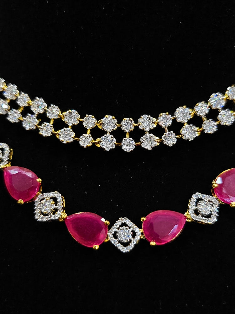 A glamorous artificial diamond and pink colored stone necklace paired with chic earrings, perfect for bridal wear. This high-quality artificial diamond jewelry set is the ideal choice for modern brides looking for a budget-friendly option with timeless sparkle.