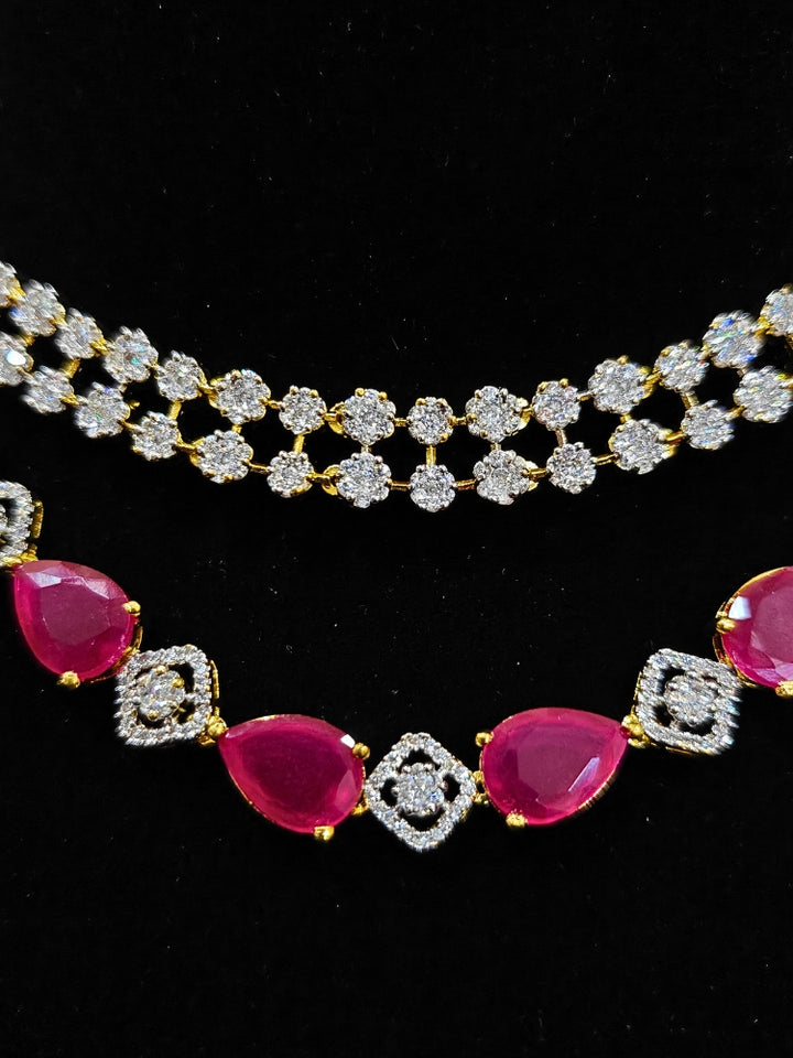 A glamorous artificial diamond and pink colored stone necklace paired with chic earrings, perfect for bridal wear. This high-quality artificial diamond jewelry set is the ideal choice for modern brides looking for a budget-friendly option with timeless sparkle.