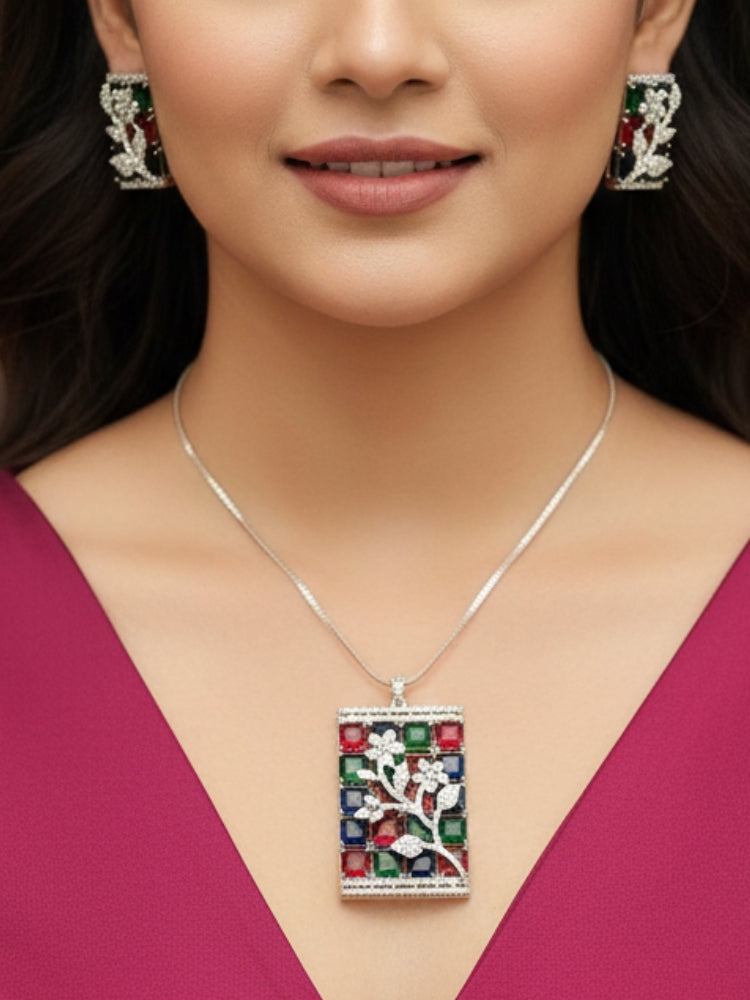 Close-up of a woman wearing an ornate Western (Silver Polish) Colored Stones Pendant set and earrings with American Diamond and Colored Stones. Modern bride styled in a luxury artificial Colored Stones Pendant Set for Party. Reception-ready look featuring a statement Colored Stones Pendant set.