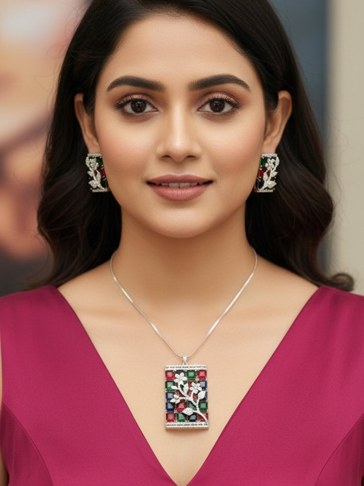 Close-up of a woman wearing an ornate Western (Silver Polish) Colored Stones Pendant set and earrings with American Diamond and Colored Stones. Modern bride styled in a luxury artificial Colored Stones Pendant Set for Party. Reception-ready look featuring a statement Colored Stones Pendant set.