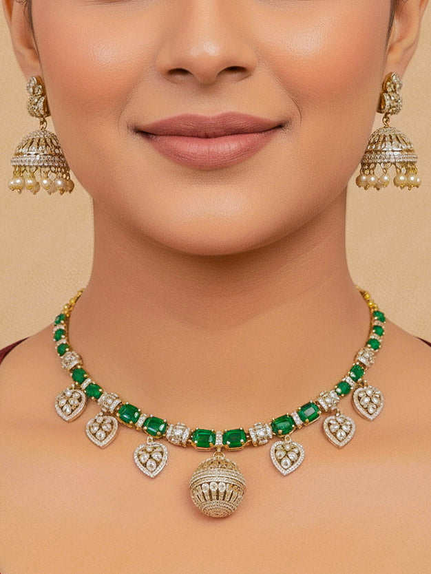 Close-up of a woman wearing an ornate traditional Green Mehendi gold Polish Collar jewellery set and earrings with American Diamond and Green Colored Stones. Mehendi function outfit styled with a lightweight Colored Stone necklace. Festive celebration look featuring a Colored Stone artificial necklace.