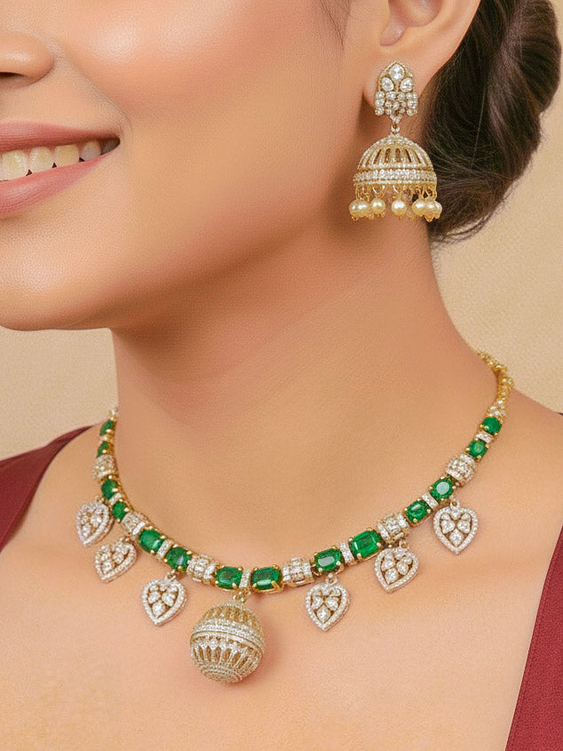 Close-up of a woman wearing an ornate traditional Green Mehendi gold Polish Collar jewellery set and earrings with American Diamond and Green Colored Stones. Mehendi function outfit styled with a lightweight Colored Stone necklace. Festive celebration look featuring a Colored Stone artificial necklace.