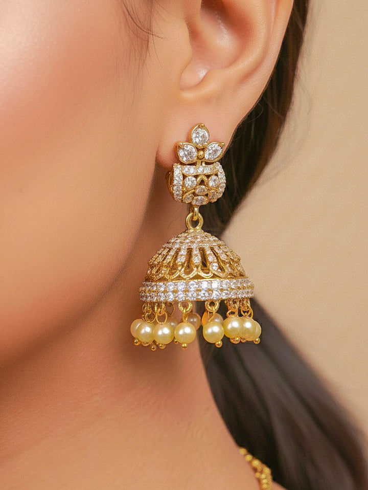 Close-up of a woman wearing an ornate traditional Green Mehendi gold Polish Collar jewellery set and earrings with American Diamond and Green Colored Stones. Mehendi function outfit styled with a lightweight Colored Stone necklace. Festive celebration look featuring a Colored Stone artificial necklace.