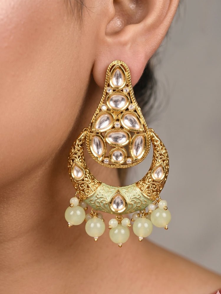 Close-up of a women wearing an ornate traditional (Gold Polish) Mint Green Long jewellery set and earrings with Polki, Crystal Beads, Meenakari and Pearls. Festive Diwali look enhanced with a premium Polki artificial necklace. Saree styling inspiration with a Long Polki imitation jewelry piece.