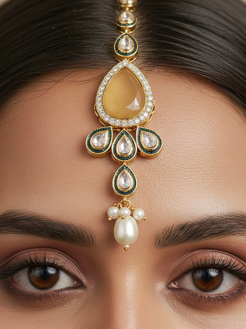 Close-up of a woman wearing an ornate traditional Peach Choker jewellery set and earrings and maangtikka with Kundan, Monalisa Stone, American Diamonds, Beads and Reverse American Diamonds and tumble stones. A graceful woman wearing a trending Colored Stone necklace for a 2026 wedding celebration. Elegant wedding jewelry look featuring a premium artificial Colored Stone necklace.