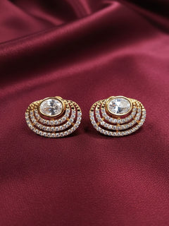 Close-up of a woman wearing an ornate  Western (Gold Polish) White Studs Earrings with American Diamond and Kundan. Indo-western dress styled with lightweight American Diamond artificial Studs Earrings. It’s comfortable and lightweight enough for everyday wear, and it also looks absolutely beautiful and elegant. The design is stylish, the finish is impressive, and it feels really pleasant to wear all day.