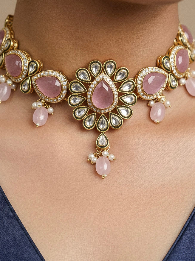 Close-up of a woman wearing an ornate traditional Pink Choker jewellery set and earrings and maangtikka with Kundan, Monalisa Stone, American Diamonds, Beads and Reverse American Diamonds and tumble stones. A graceful woman wearing a trending Colored Stone necklace for a 2026 wedding celebration. Elegant wedding jewelry look featuring a premium artificial Colored Stone necklace.