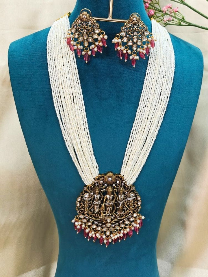 Dummy, wearing a Pink Rama Necklace Set—an ornate Kundan necklace with intricate designs and matching American Diamond earrings. Perfect necklace to add to your temple necklace collection. 