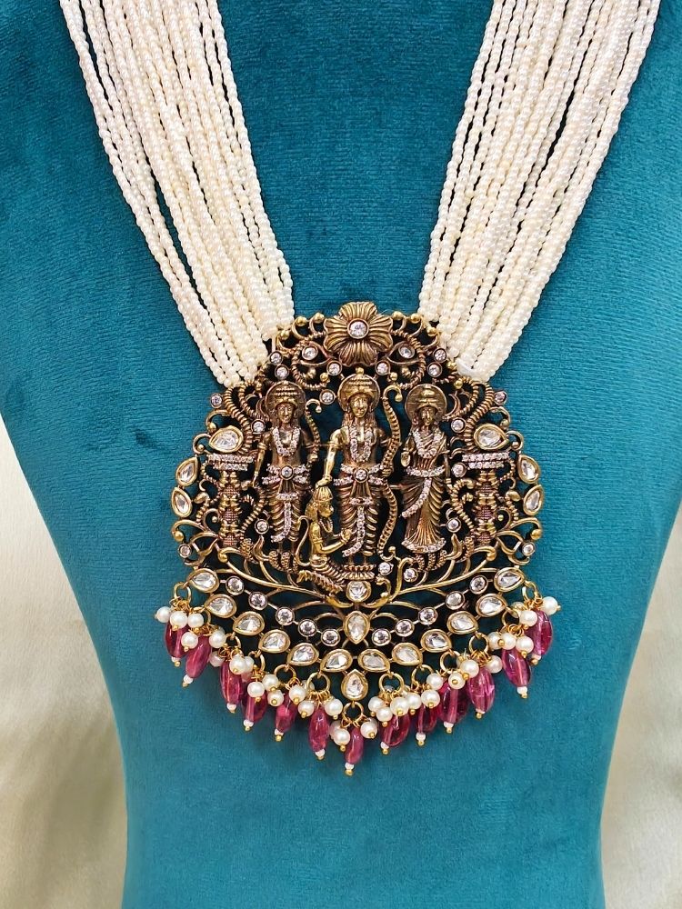 Dummy, wearing a Pink Rama Necklace Set—an ornate Kundan necklace with intricate designs and matching American Diamond earrings. Perfect necklace to add to your temple necklace collection. 