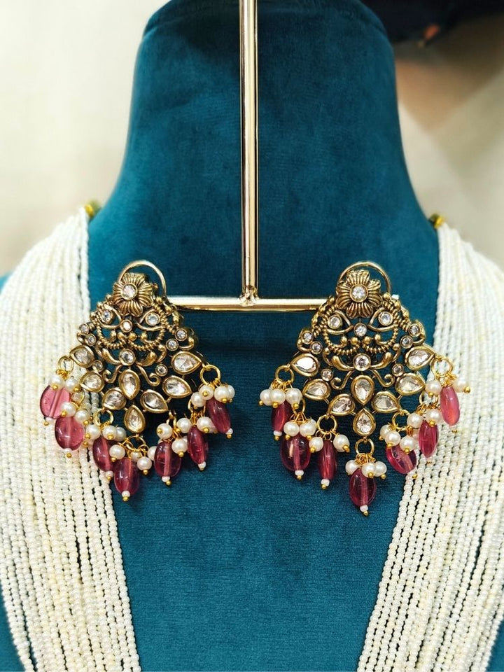 Dummy, wearing a Pink Rama Necklace Set—an ornate Kundan necklace with intricate designs and matching American Diamond earrings. Perfect necklace to add to your temple necklace collection. 