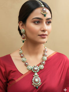 Close-up of a woman wearing an ornate traditional Pink Jewelry Set, Earrings and Mangtikka with Kundan and Colored Stones. Bride wearing a traditional Kundan artificial necklace set for her wedding ceremony. Woman wearing trending Kundan artificial jewelry for wedding season in India.