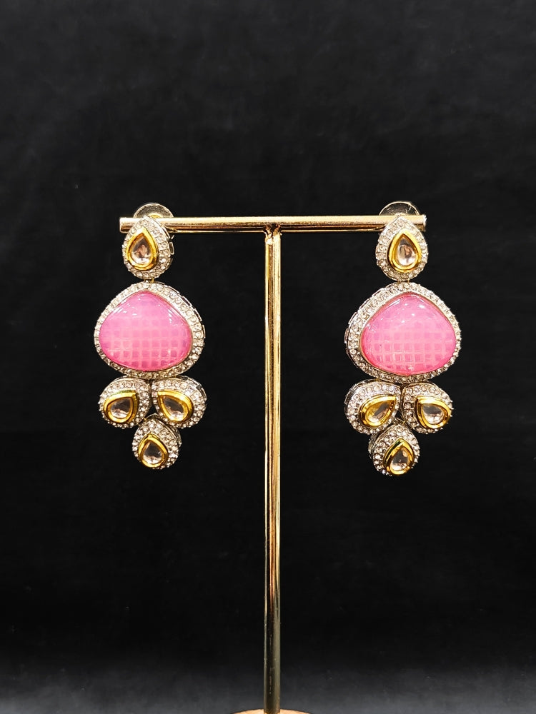 Close-up of an ornate traditional Pink Collar Kundan jewellery set and earrings with American diamonds, Monalisa stone, Pearls, Kundan and Colored Stones. Festive Diwali outfit paired with a premium Kundan jewelry piece. A trending Kundan artificial jewelry for wedding season in India.