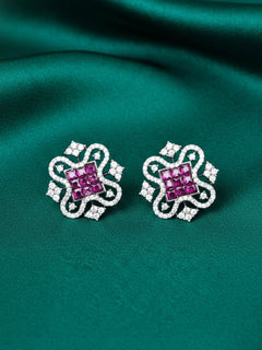 Close-up of an ornate Western (Silver Polish) Pink Diamond Studs Earrings with American Diamond. western dress styled with lightweight artificial American Diamond studs earrings. Wear in office and everyday.