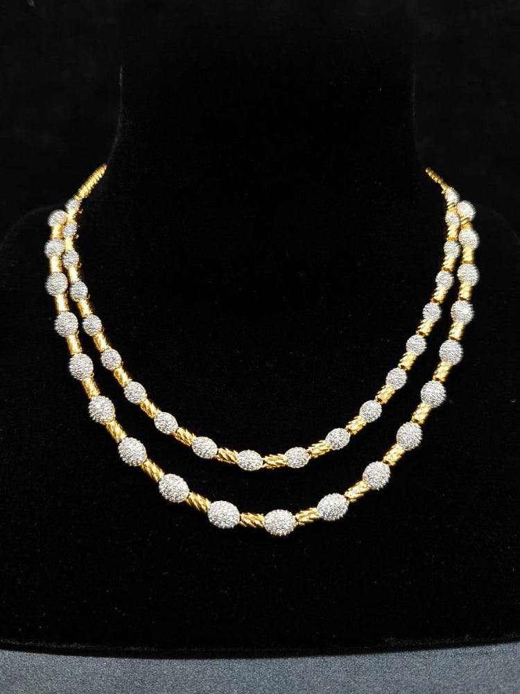 An elegant artificial diamond Layered necklace and matching earrings. This premium artificial diamond jewelry set is perfect for special occasions, from Indian weddings to engagement parties, offering sophisticated glamour without the high price tag.