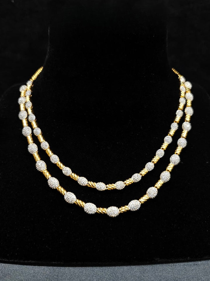An elegant artificial diamond Layered necklace and matching earrings. This premium artificial diamond jewelry set is perfect for special occasions, from Indian weddings to engagement parties, offering sophisticated glamour without the high price tag.