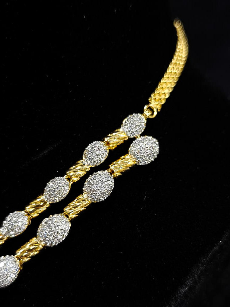 An elegant artificial diamond Layered necklace and matching earrings. This premium artificial diamond jewelry set is perfect for special occasions, from Indian weddings to engagement parties, offering sophisticated glamour without the high price tag.