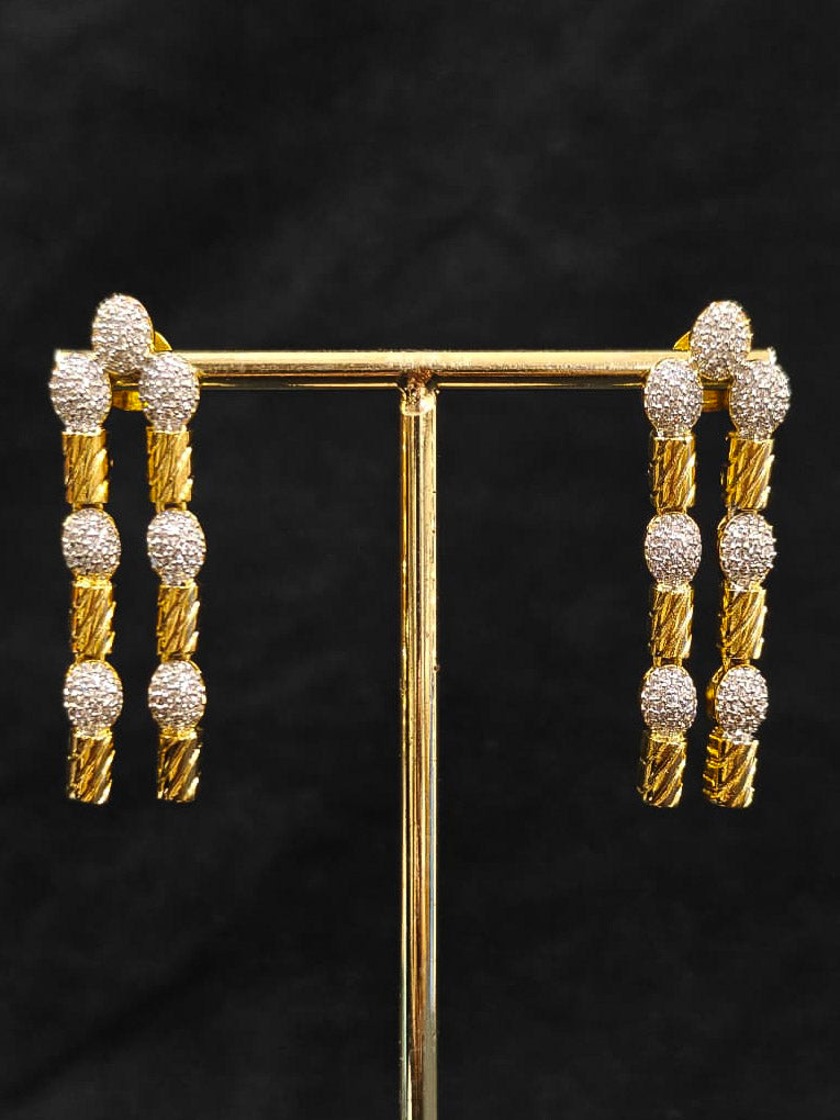 An elegant artificial diamond Layered necklace and matching earrings. This premium artificial diamond jewelry set is perfect for special occasions, from Indian weddings to engagement parties, offering sophisticated glamour without the high price tag.